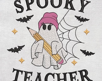 May include: Embroidered design featuring a ghost wearing a pink beanie and holding a pencil, with the words "SPOOKY TEACHER" above and below. Includes bats and stars.