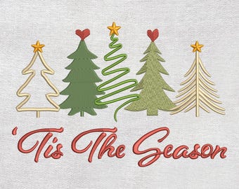 May include: Embroidered design featuring five Christmas trees in varying styles and colors, topped with stars and hearts. The phrase "'Tis The Season" is written in red script below the trees, set against a textured white background.