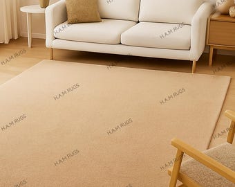 Alfombra beige crema lisa para sala de estar y dormitorio. Moderna y neutra, de lana suave y personalizada, con mechones hechos a mano.