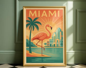 May include: A framed art print with a retro Miami travel theme. The artwork features a flamingo, palm trees, and a cityscape against a sunset backdrop. The word "MIAMI" is displayed at the top in bold letters. The frame is gold.