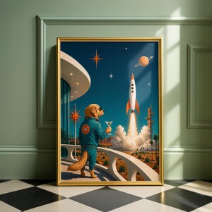 May include: A framed wall art print depicting a golden retriever wearing a blue flight suit and sunglasses, standing on a balcony while holding a martini glass. A rocket launches into a dark blue sky filled with stars and a planet above a desert.