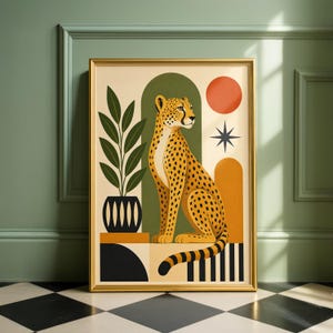 May include: A framed art print depicting a stylized cheetah with black spots, set against geometric shapes in orange, green, and black. The artwork, in a gold frame, includes a red sun and a black star. The print is a decorative item.