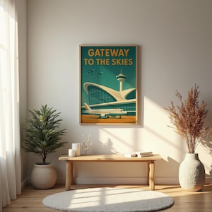 May include: A framed vintage-style travel poster with the text "Gateway to the Skies" above an illustration of an airport terminal and a passenger airplane. The poster is displayed on a wall above a wooden bench with decorative items.