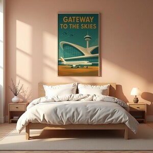 May include: A framed art print titled "Gateway to the Skies" depicts an airport scene with an airplane, control tower, and terminal building. The artwork features a retro style with a teal, orange, and beige color palette.