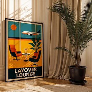 May include: A framed art print with a retro travel theme. The artwork depicts a stylized airport lounge scene with an airplane, chairs, and a cocktail. The words "LAYOVER LOUNGE" are at the bottom. The print is displayed in a room with a large potted plant.