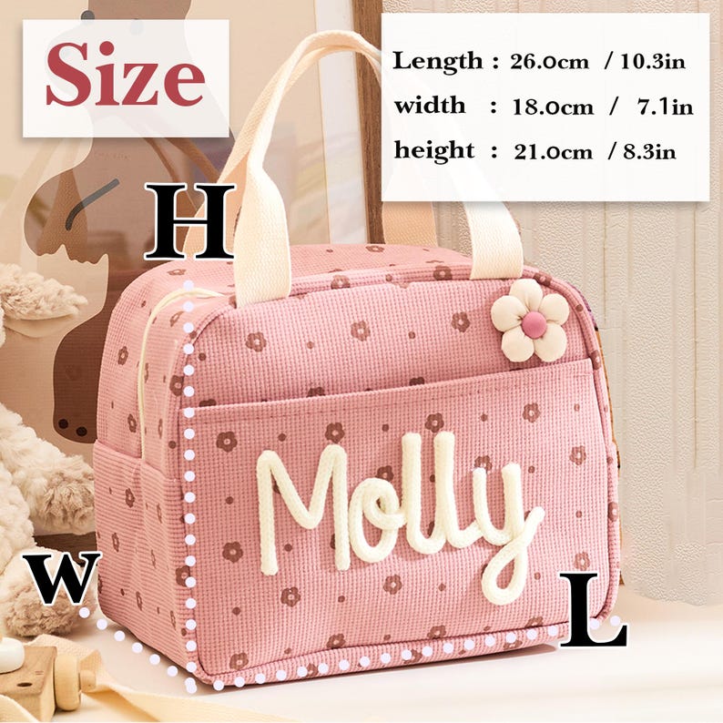 May include: Pink lunch bag with a floral pattern and the name "Molly" in white. The bag has a white handle and a flower accent. Dimensions: 10.3 inches long, 7.1 inches wide, and 8.3 inches high.