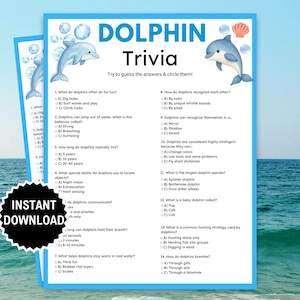 May include: Two blue sheets with dolphin trivia questions. The title "DOLPHIN Trivia" is at the top, with illustrations of dolphins. The words "INSTANT DOWNLOAD" are on a black sticker.