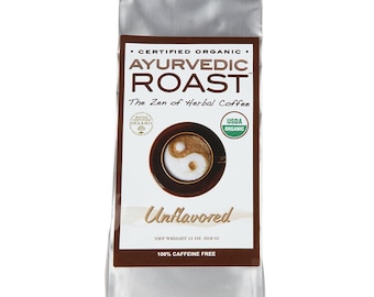 May include: A silver bag of certified organic Ayurvedic Roast herbal coffee. The bag features a yin yang symbol and the text "The Zen of Herbal Coffee". The bag is 11 ounces and 100% caffeine free.