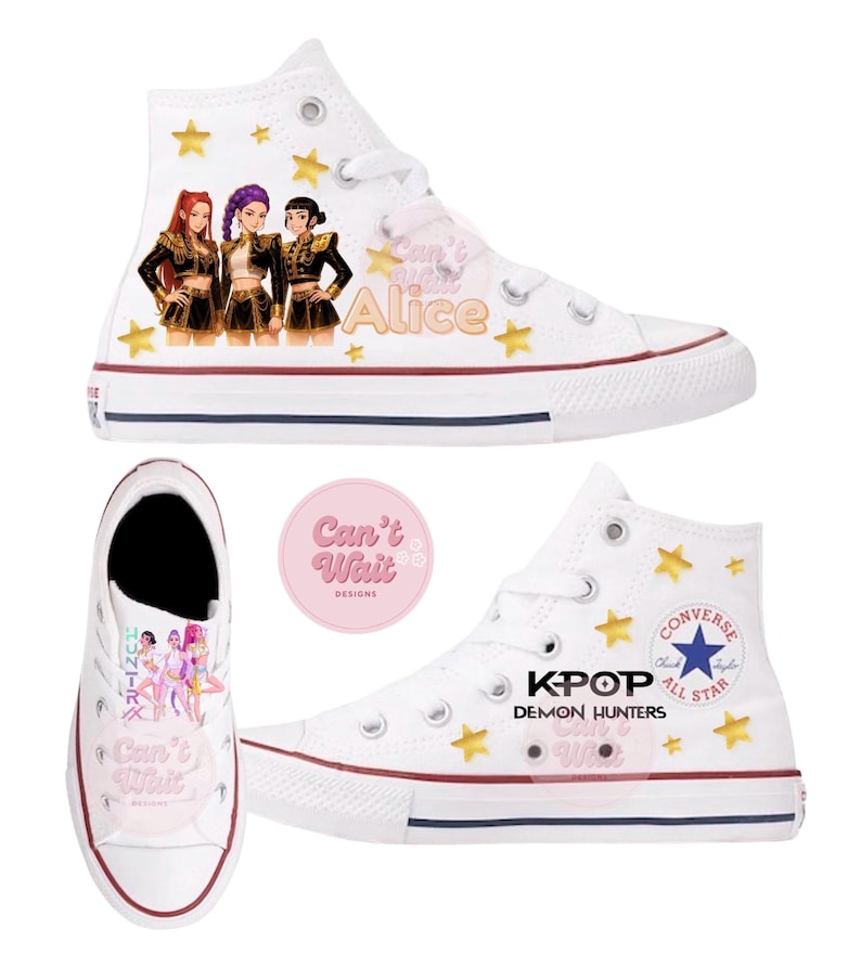 May include: White high-top Converse sneakers with custom artwork. The sneakers feature a design with a K-pop theme, including illustrations of three figures, gold stars, and the text "Can't Wait Alice" and "KPOP Demon Hunters".