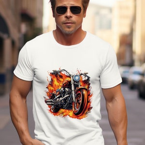 May include: White t-shirt with a graphic of a motorcycle engulfed in flames.