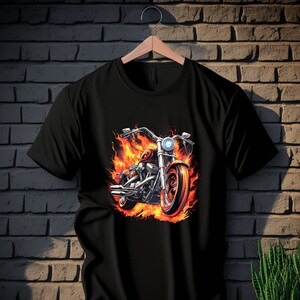 May include: Black t-shirt with a graphic of a motorcycle engulfed in flames.