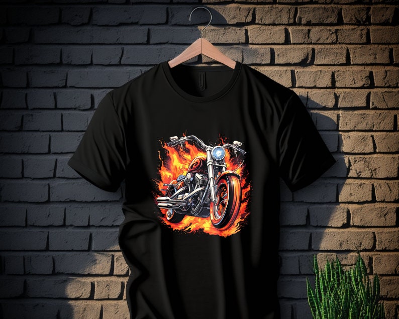 May include: Black t-shirt with a graphic of a motorcycle engulfed in flames.