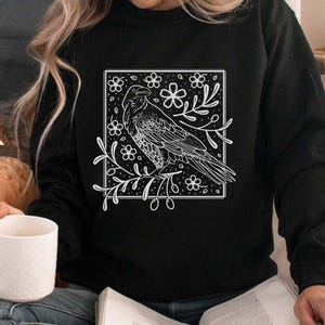 Raven Sweatshirt with Whimsigoth folklore Aesthetic | Linocut Print Design | Floral Forestcore Crow Shirt | Whimsy Cottagecore bird pullover