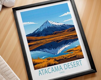 Puede incluir: Un póster enmarcado con una ilustración colorida de una montaña reflejada en un lago. El texto "ATACAMA DESERT CHILE" está en la parte inferior del póster.
