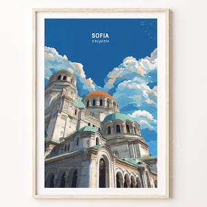 May include: Framed art print of the Alexander Nevsky Cathedral in Sofia, Bulgaria. The artwork features the cathedral's white facade, turquoise domes, and a copper-colored dome against a blue sky with fluffy clouds. The word "SOFIA" is at the top.