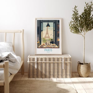 May include: A vintage-style poster with an illustration of the Eiffel Tower in Paris, France. The poster shows a person sitting at a table with a view of the Eiffel Tower. The poster has the text "PARIS FRANCE" at the bottom.