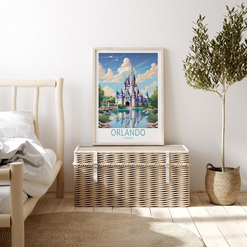 May include: A vintage-style poster featuring a colourful illustration of Cinderella's Castle at Walt Disney World in Orlando, Florida. The poster has a blue sky with white clouds and a reflection of the castle in a lake. The text "ORLANDO FLORIDA" is printed at the bottom of the poster.