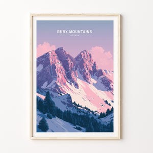 May include: A framed art print featuring the Ruby Mountains in Nevada. The artwork depicts snow-capped peaks with pink and purple hues under a soft, pastel sky. The text "RUBY MOUNTAINS NEVADA" is at the top.