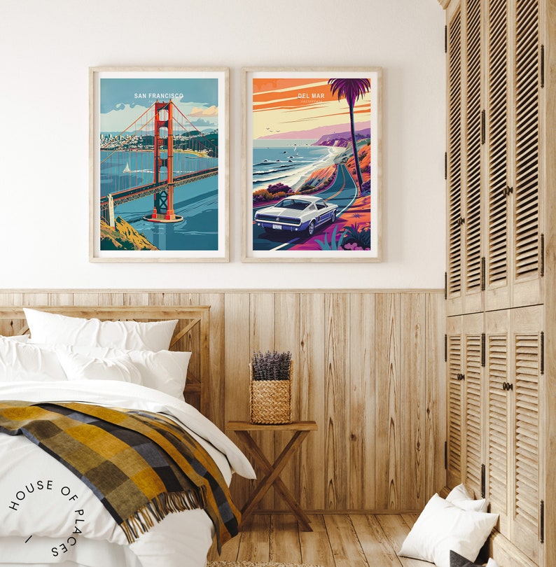 May include: Two framed travel posters, one with a view of the Golden Gate Bridge in San Francisco and the other with a view of a car driving along the Pacific Coast Highway in Del Mar, California.