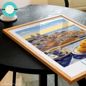 May include: A framed illustration of a cityscape with a cup of tea and pastries on a table in the foreground. The city is painted in a warm, colorful style with a blue sky and a golden sunset. The text "House of Places Design Studio" is visible in the top left corner of the frame.