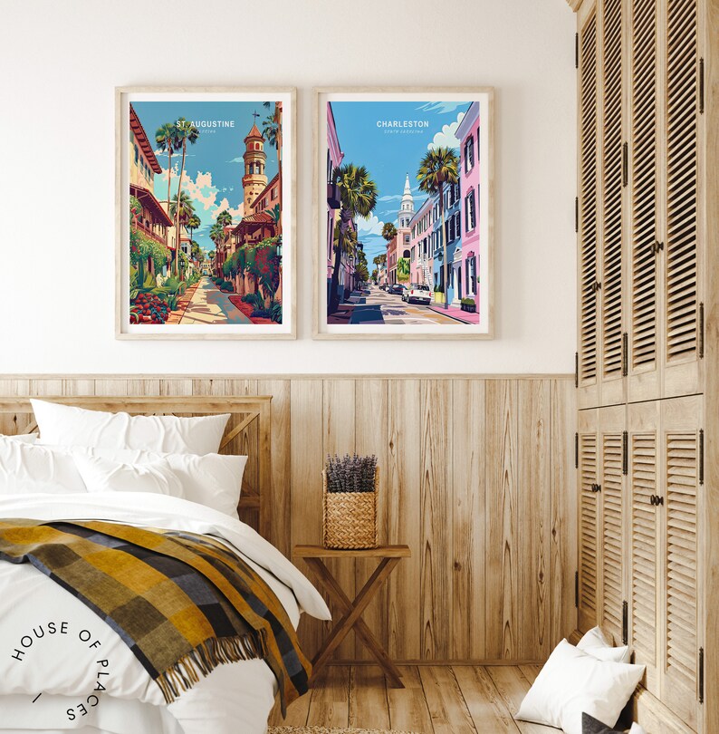 May include: Two framed illustrations of cityscapes. The left illustration shows a street in St. Augustine, Florida, with a tall building with a clock tower. The right illustration shows a street in Charleston, South Carolina, with a church steeple in the background.