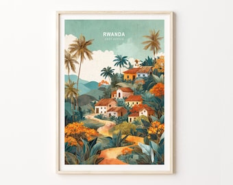 May include: A framed art print featuring a watercolor illustration of a village in Rwanda, East Africa. The artwork depicts houses with orange roofs nestled among lush greenery, palm trees, and a winding road. The sky is a soft teal color.