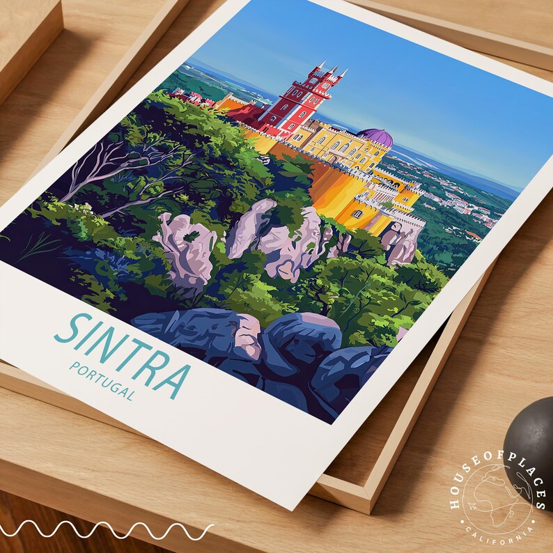 May include: A travel poster for Sintra, Portugal, depicting Pena Palace in vibrant colours on a green hillside. The poster, with a white border, displays the word "Sintra" in teal. It is presented in a wooden tray.