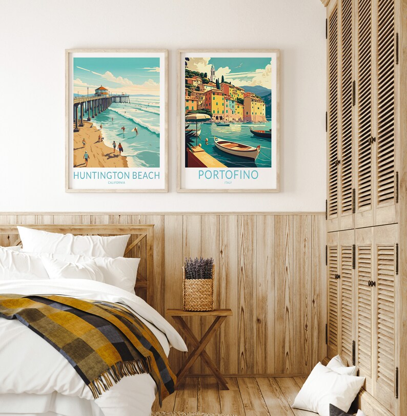 May include: Two framed travel posters, one depicting Huntington Beach, California, with a pier and surfers, and the other depicting Portofino, Italy, with colorful buildings and a boat in the water.