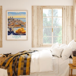 May include: A framed poster with a vintage illustration of Lisbon, Portugal, featuring a cityscape with buildings and a river. The poster also includes a cup of coffee and three pastries on a plate. The poster is hanging on a white wall above a bed with white bedding and a yellow and black plaid blanket.