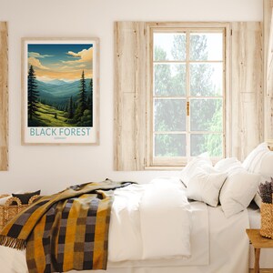 May include: A framed poster with a vintage travel illustration of a mountain range with the text "BLACK FOREST GERMANY" at the bottom.