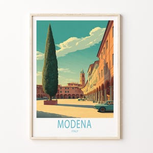 May include: A framed art print depicting Modena, Italy, with a tall cypress tree in a sunlit square. Buildings with arched walkways and a vintage teal car are visible. The sky is a bright turquoise with fluffy white clouds. The word "MODENA" and "ITALY" are printed at the bottom.