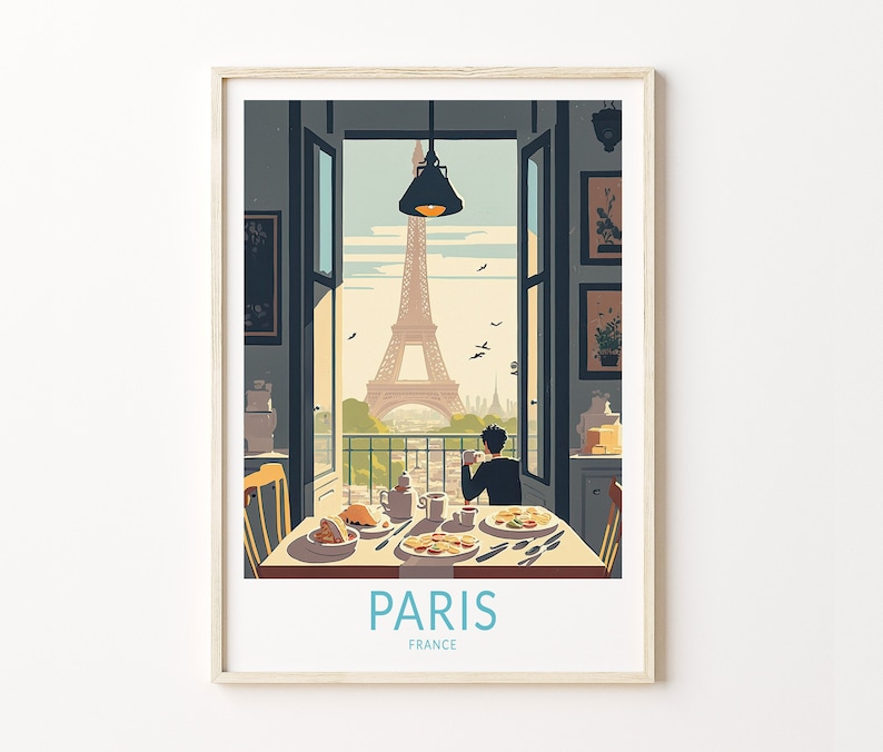 May include: A framed illustration of a person sitting at a table with a view of the Eiffel Tower in Paris, France. The illustration is in a vintage style with a muted color palette. The text "PARIS" and "FRANCE" is printed below the image.