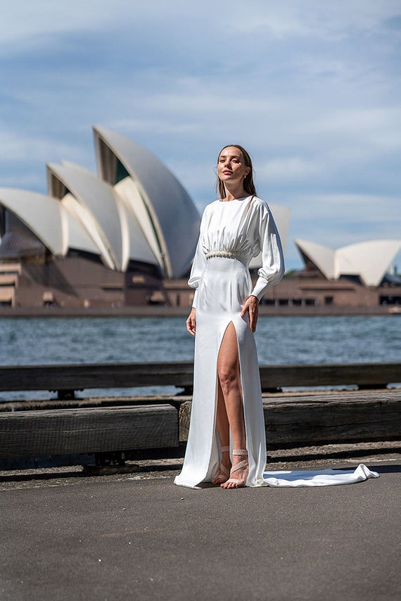 empire waistline wedding dress Waist Organza Ballroom Gown with Swag Sleeve This specially designed wedding dress model with smocked and puffy balloon sleeves displays a feminine look with its deep v Strapless Empire Waist Wedding Dress