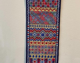 Red, blue and gold wall hanging