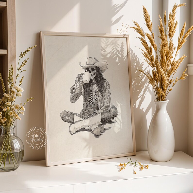 Detailed black-and-white illustration of a skeleton cowgirl in a hat and boots, sitting cross-legged while drinking coffee, rustic gothic western style.