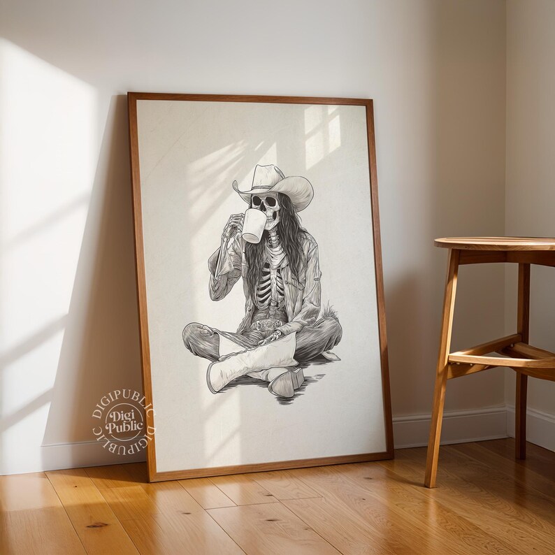 Detailed black-and-white illustration of a skeleton cowgirl in a hat and boots, sitting cross-legged while drinking coffee, rustic gothic western style.