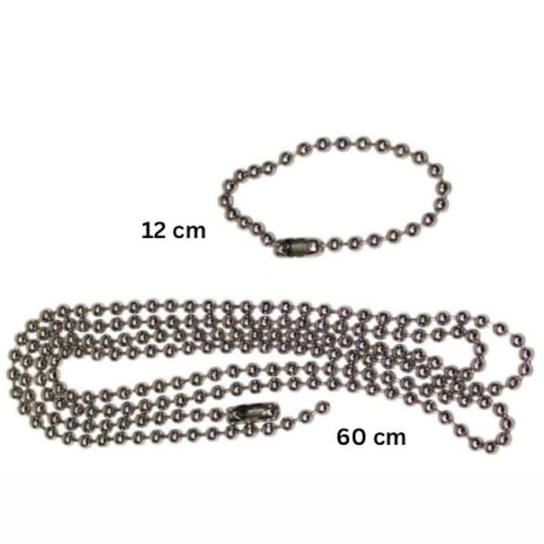 May include: Two silver ball chain necklaces, one 12 inches long and the other 60 inches long.