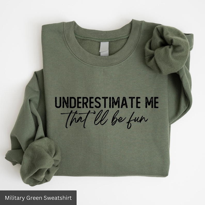 a t - shirt that says, underestimate me that'll be