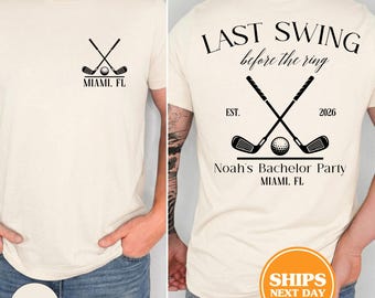 May include: An ivory t-shirt featuring a black graphic of two crossed golf clubs and a golf ball on the front left chest. The back displays the text LAST SWING before the ring, EST. 2026, Noah's Bachelor Party, and MIAMI, FL with golf clubs.