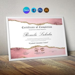 May include: A white framed certificate of completion for an Eyelash Extension Course, featuring pink watercolor accents, gold glitter borders, and an illustration of eyes with long lashes, with text for a name, instructor, and date.