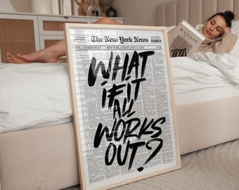 May include: A framed print featuring a newspaper background with the text "WHAT IF IT ALL WORKS OUT?". The print has a light wood frame. The newspaper is dated July 27, 2025, from The New York News.
