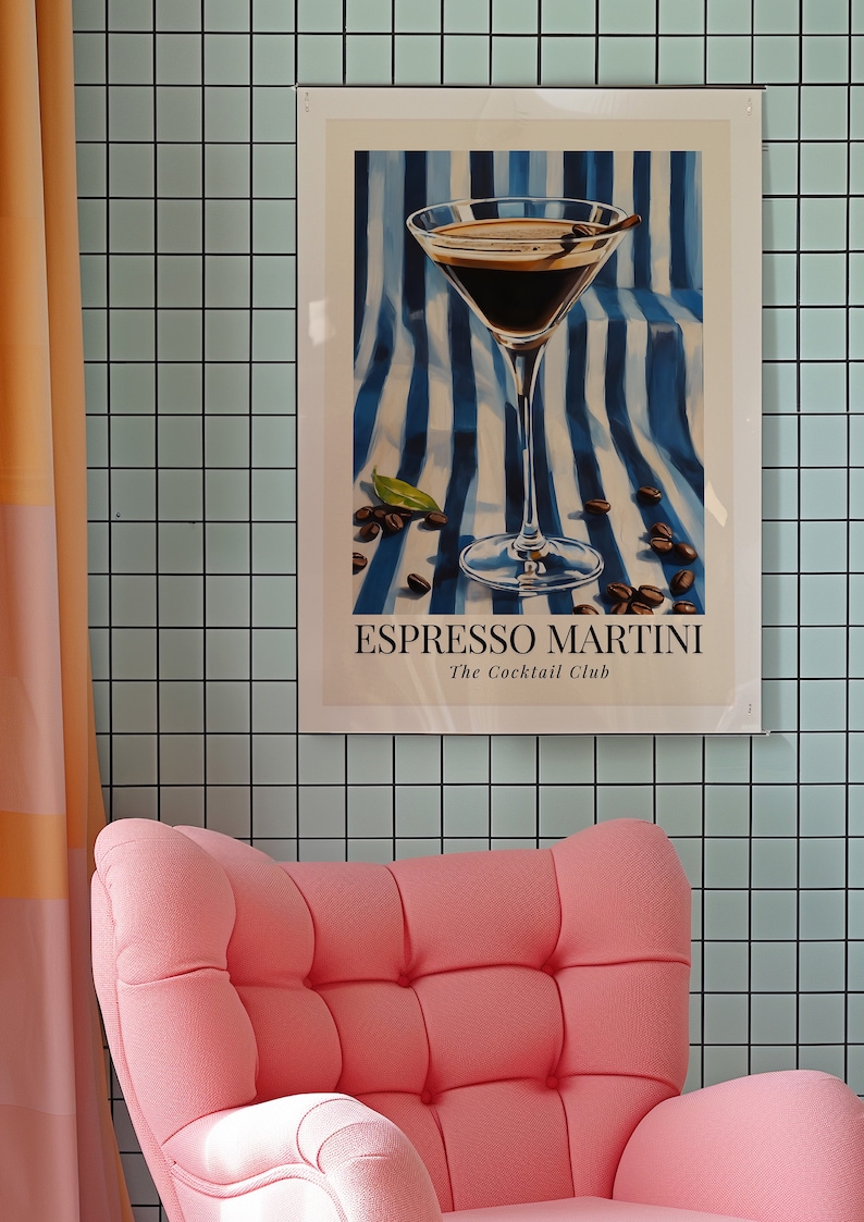May include: A framed poster with a blue and white striped background featuring a martini glass filled with a dark liquid. The text on the poster reads "Espresso Martini The Cocktail Club".