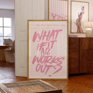 May include: A framed vertical poster featuring a newspaper-style background with the text "WHAT IF IT ALL WORKS OUT?" written in large, bold, pink brush-stroke lettering. The poster is displayed in a light wood frame, showcasing a newspaper layout.
