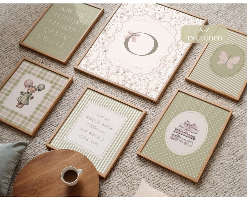 May include: A collection of framed art prints with a soft, vintage aesthetic. The prints feature various designs, including an alphabet, floral patterns, a teddy bear with balloons, a butterfly, and a stack of books. The color palette includes muted greens, pinks, and creams.