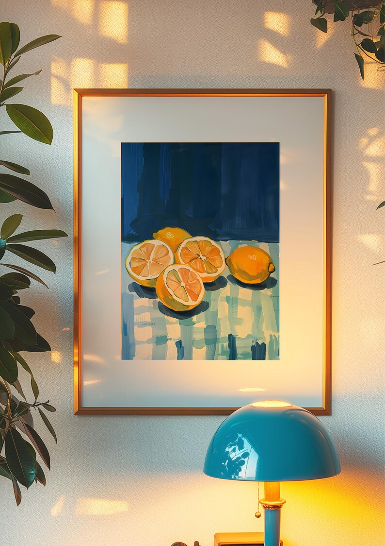 May include: A framed painting of lemons on a blue and white checkered tablecloth. The lemons are yellow and have been cut in half, revealing their juicy insides. The background is a dark blue.