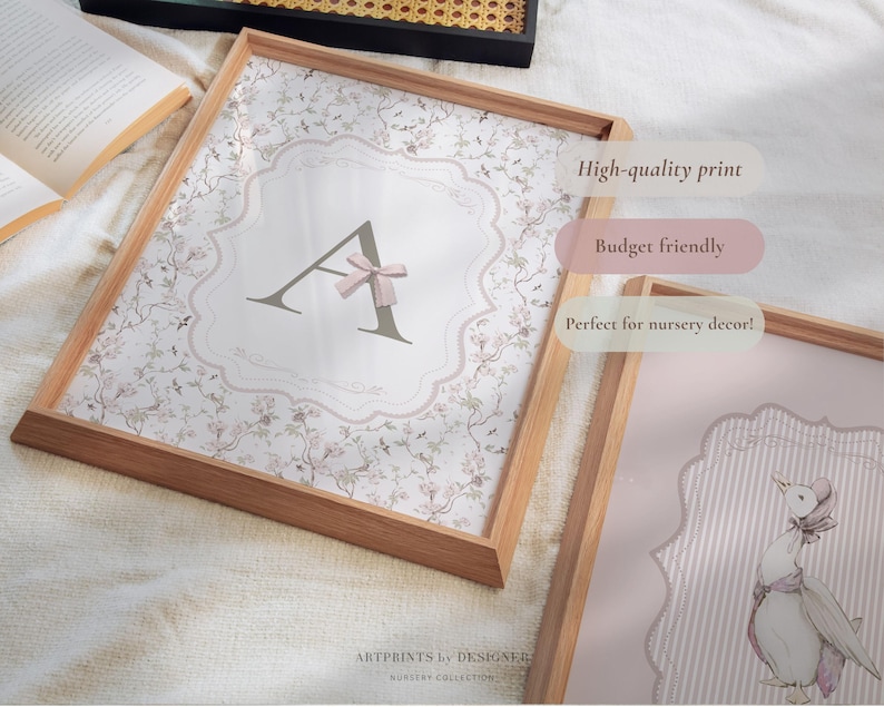 May include: Wooden framed print featuring the letter "A" with a pink bow, set against a floral background. The print is in a wooden frame. The text "High-quality print" and "Budget friendly" are visible.