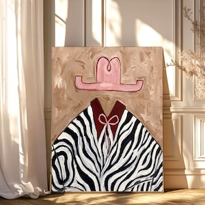May include: A rectangular canvas painting featuring a pink cowboy hat positioned above a dark red collared shirt with a thin pink tie. The shirt displays a black and white zebra stripe pattern. The background is a textured, light beige paint.