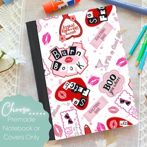 May include: A notebook with a white cover featuring pink and red graphics, including lipstick kisses, hearts, and the text "Burn Book." The notebook has a black spine and the text "Choose Premade Notebook or Covers Only."
