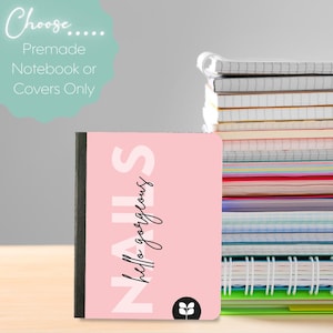 May include: A pink notebook with the word "NAILS" in large white letters and "hello gorgeous" in cursive. A stack of notebooks is in the background. The text "Choose... Premade Notebook or Covers Only" is in the upper left.