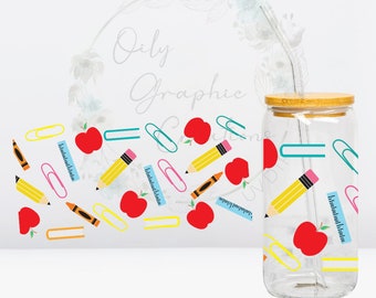 May include: A clear glass tumbler with a bamboo lid and a reusable straw. The tumbler is decorated with a pattern of red apples, yellow pencils, blue rulers, and pink paper clips.